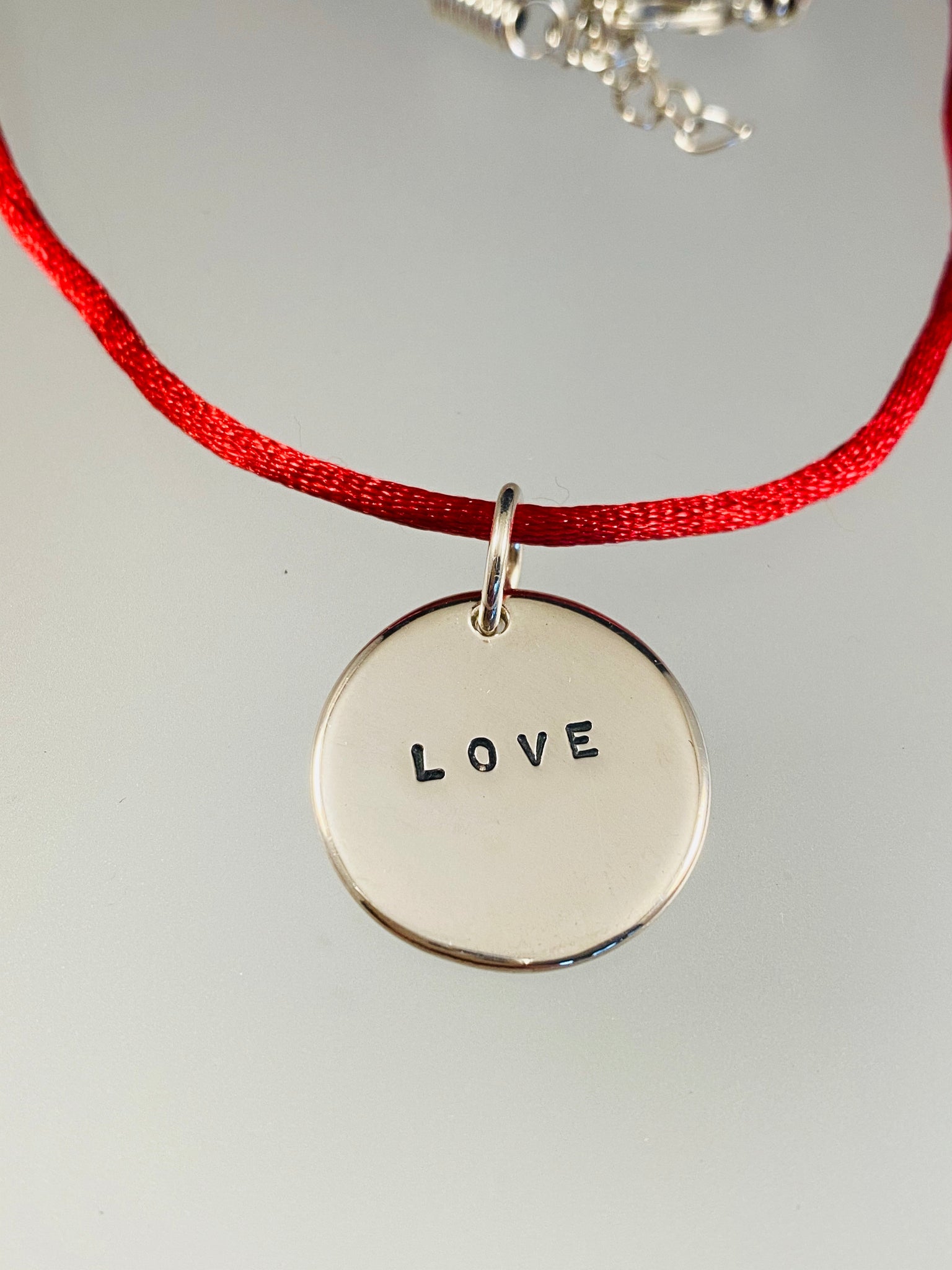 Sterling 'Love' Charm on Red Satin Cord